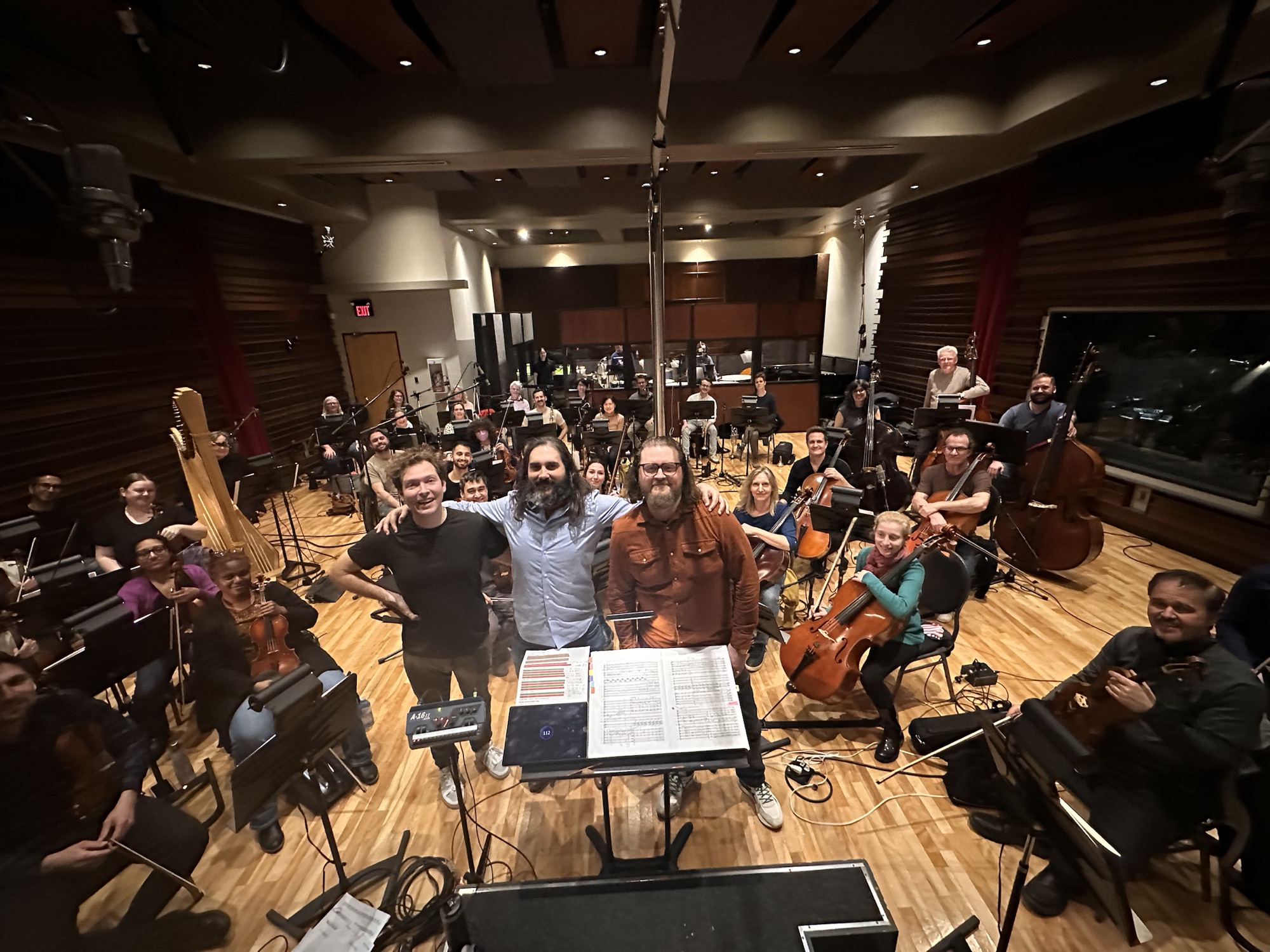 Canadian Studio Symphony musicians gathered together in the recording room